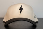cream cap with black brim and a single black lightning bolt embroidered on the front