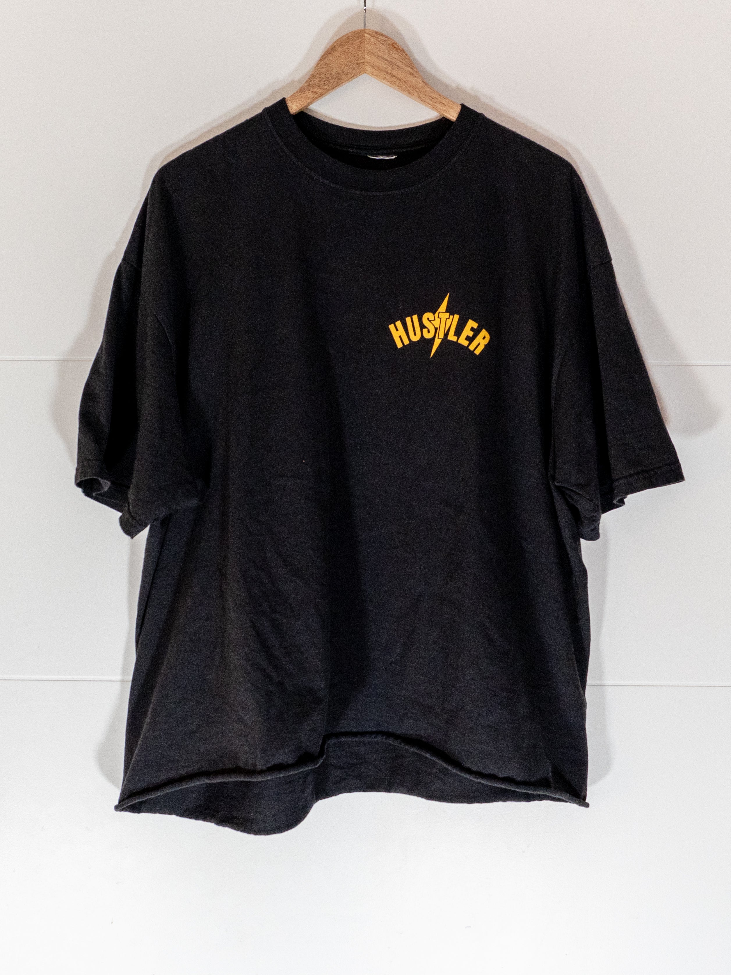 hustlers sports club black oversized box tee with hustler bolt wordmark at chest