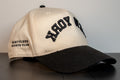 alt: side view of the new york cap with hustlers sports club embroidered on the panel